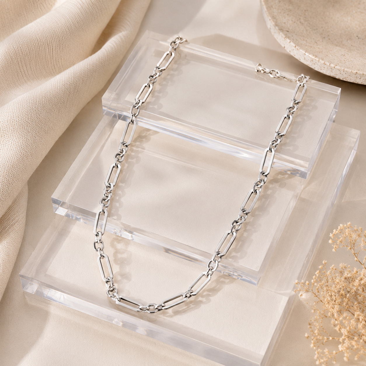 Full view of the Bold Silver Paperclip Link Statement Chain laid out on clear acrylic display blocks, highlighting the lobster clasp closure. 
