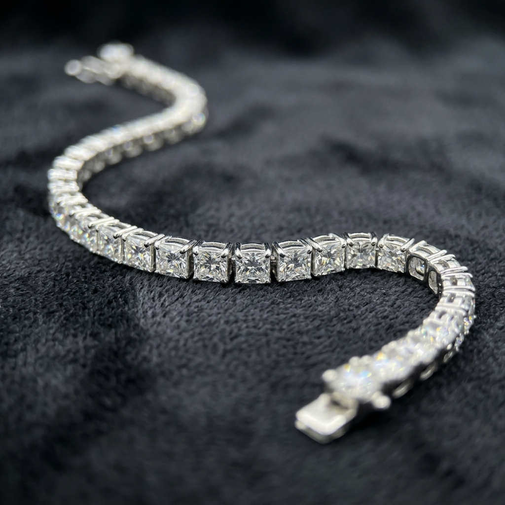 Detailed macro close-up of the Classic Diamond Tennis Silver Bracelet resting in a curved 'S' shape on dark velvet, highlighting the brilliant-cut stones and four-prong settings
