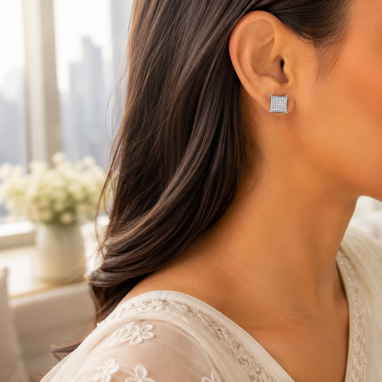 Side profile of a woman wearing the sparkling Concave Square Pave Silver Stud Earrings