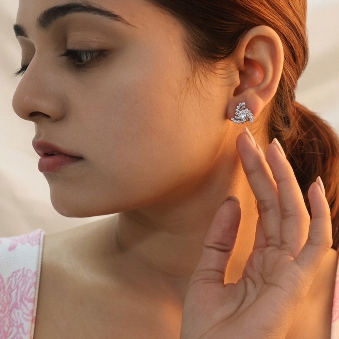 Side profile of an Indian woman wearing the Crystal Swirl Silver Stud Earring