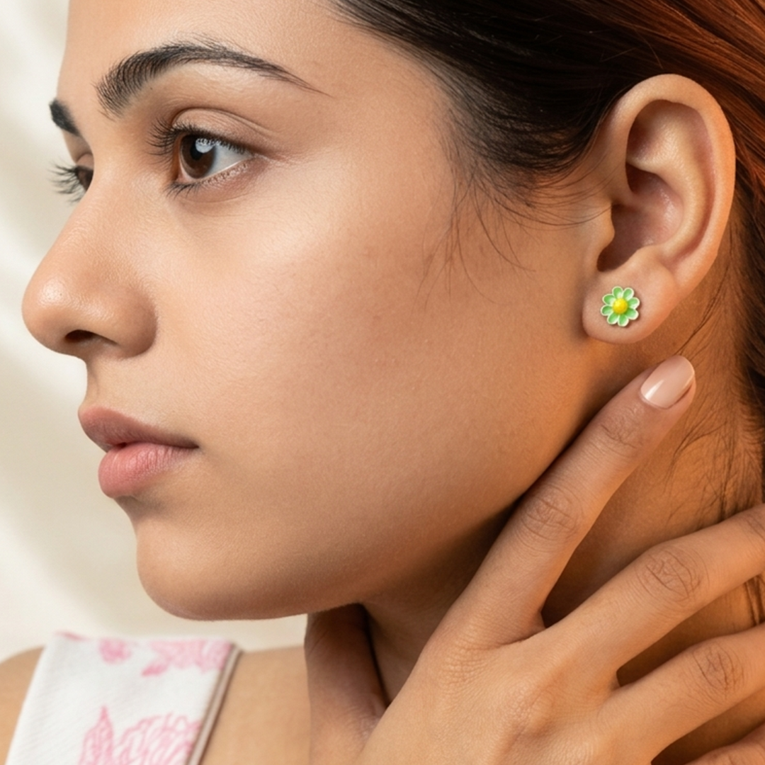 Close-up of a woman wearing a Dainty Green Floral Enamel Silver Stud Earring