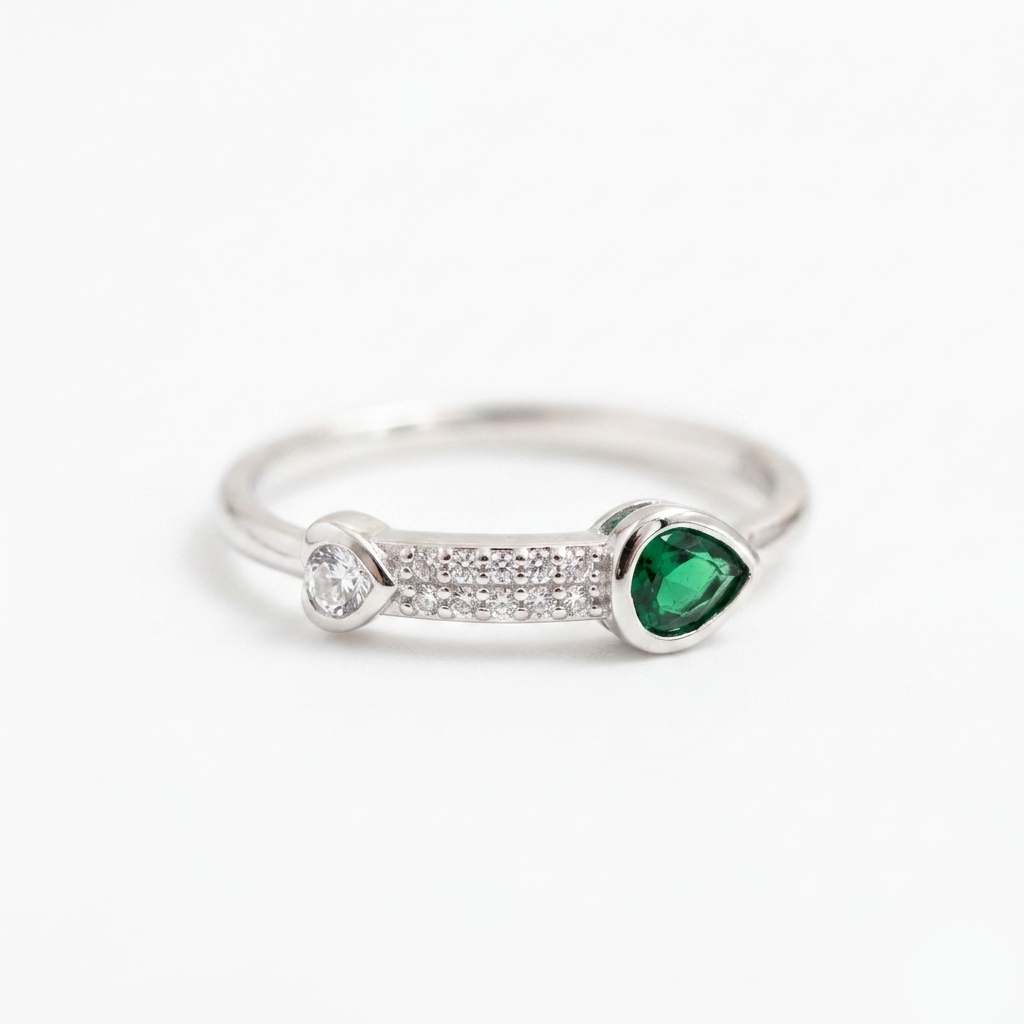 Close-up front view of the Emerald Heart Pave Sterling Silver Ring showing the detailed green stone and pave crystal bridge.