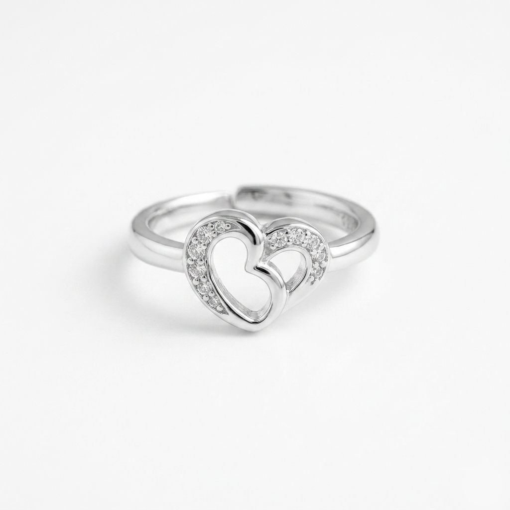 Detailed front view of the Interlocking Heart Sterling Silver Ring with clear stones on a white background