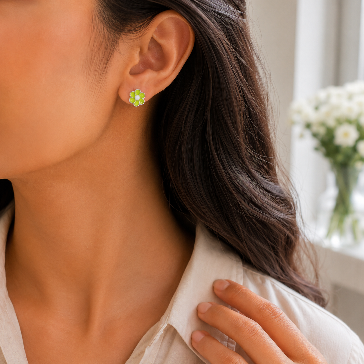 Side profile of a woman wearing the Lime Green Floral Enamel Silver Stud Earrings.