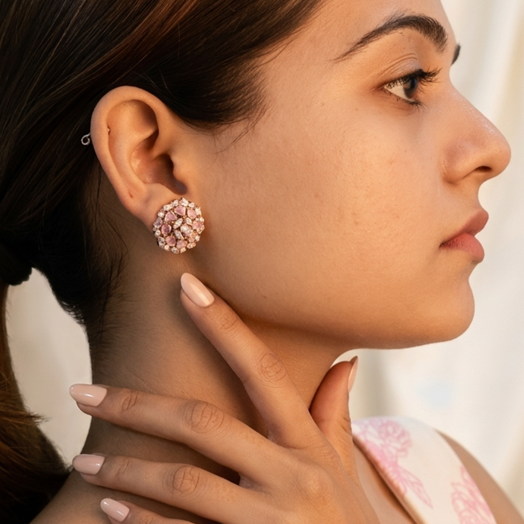 Side profile portrait of an Indian woman wearing the Pink Stone Floral Silver Cluster Stud Earrings, paired with a soft pink outfit
