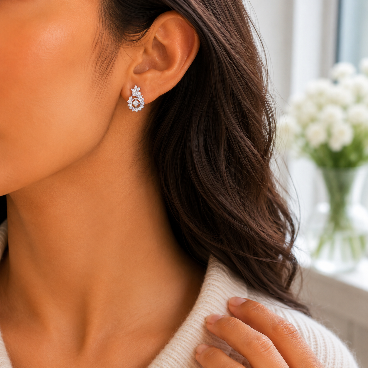 Side profile of a woman wearing the Radiant Floral Swirl Silver Stud Earring showing its scale and sparkle