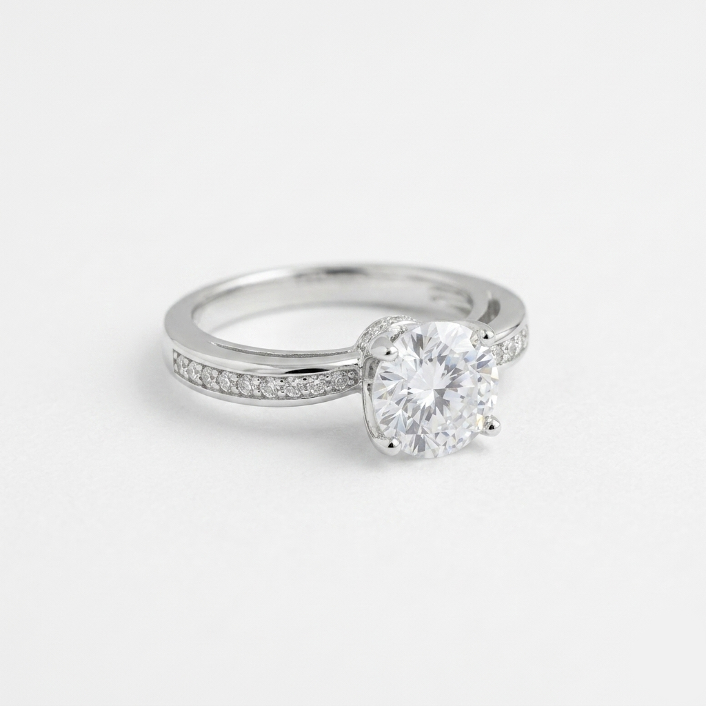 Macro shot of a Radiant Round Cut Silver Pave Solitaire Ring highlighting the prong setting and pavé band details on a white background 