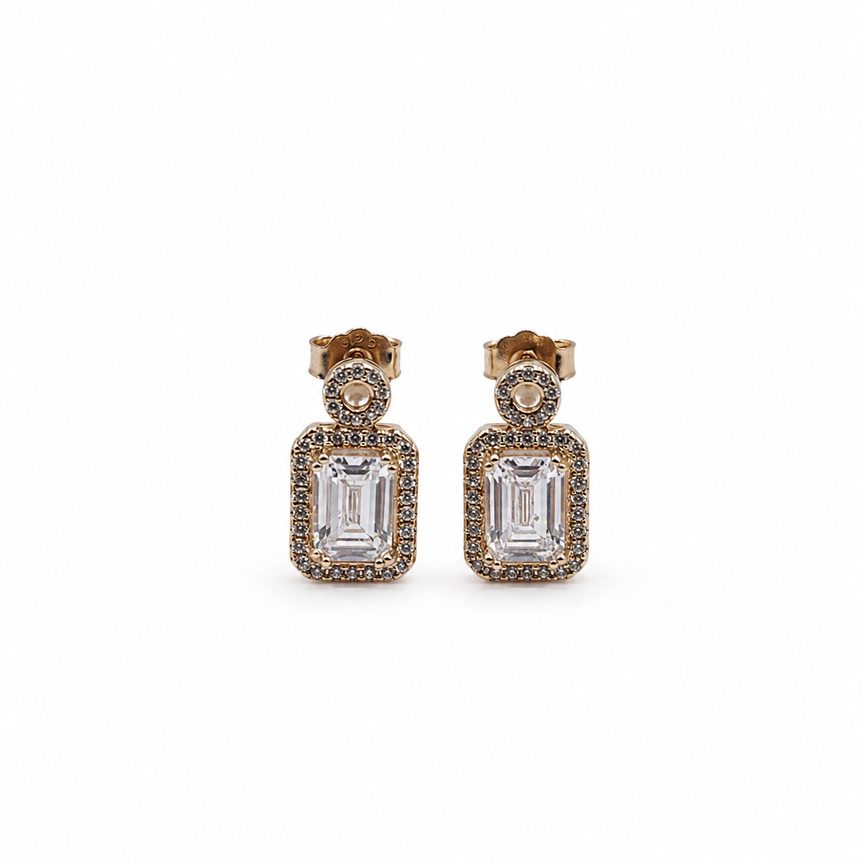Rose Gold Round Halo Emerald Cut Drop Earrings with a round halo top and emerald-cut centre stone framed by a rectangular halo