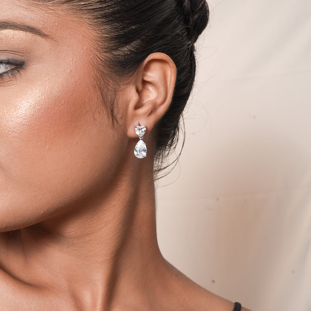 Close-up of Silver Heart & Pear CZ Drop Earrings showing a heart-shaped CZ stud with a pear-shaped CZ drop