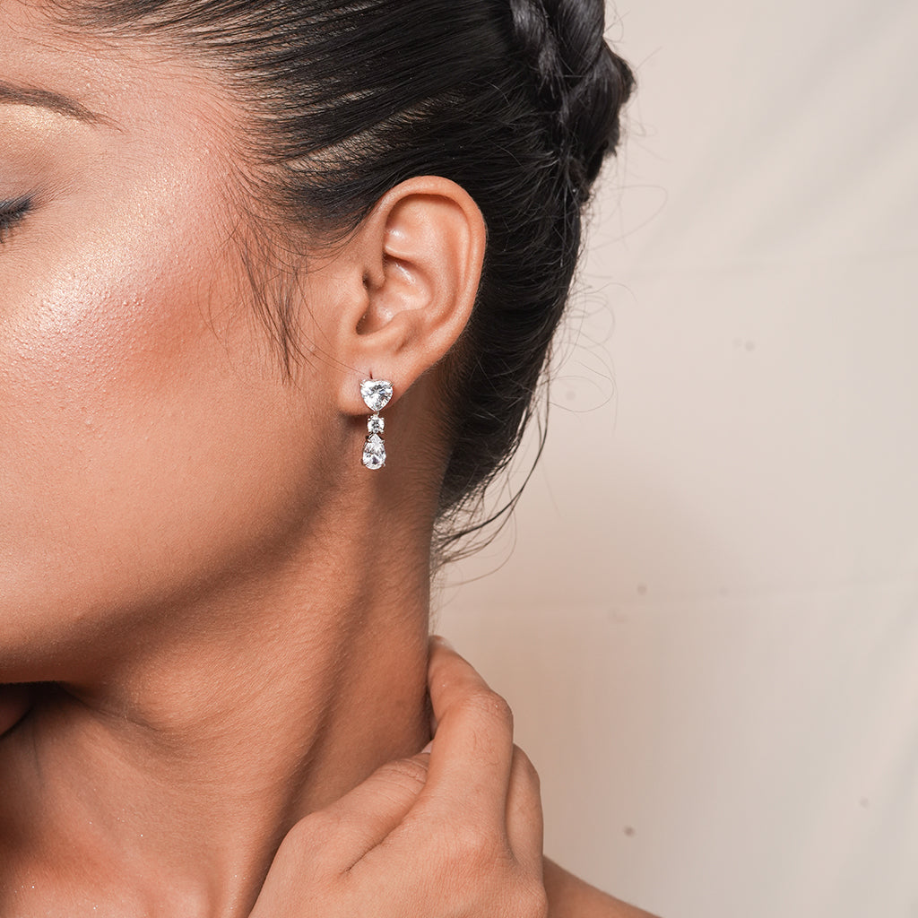 Close-up of Silver Heart Round & Pear CZ Drop Earrings showing a heart-shaped CZ stud, round CZ connector and pear-shaped CZ drop