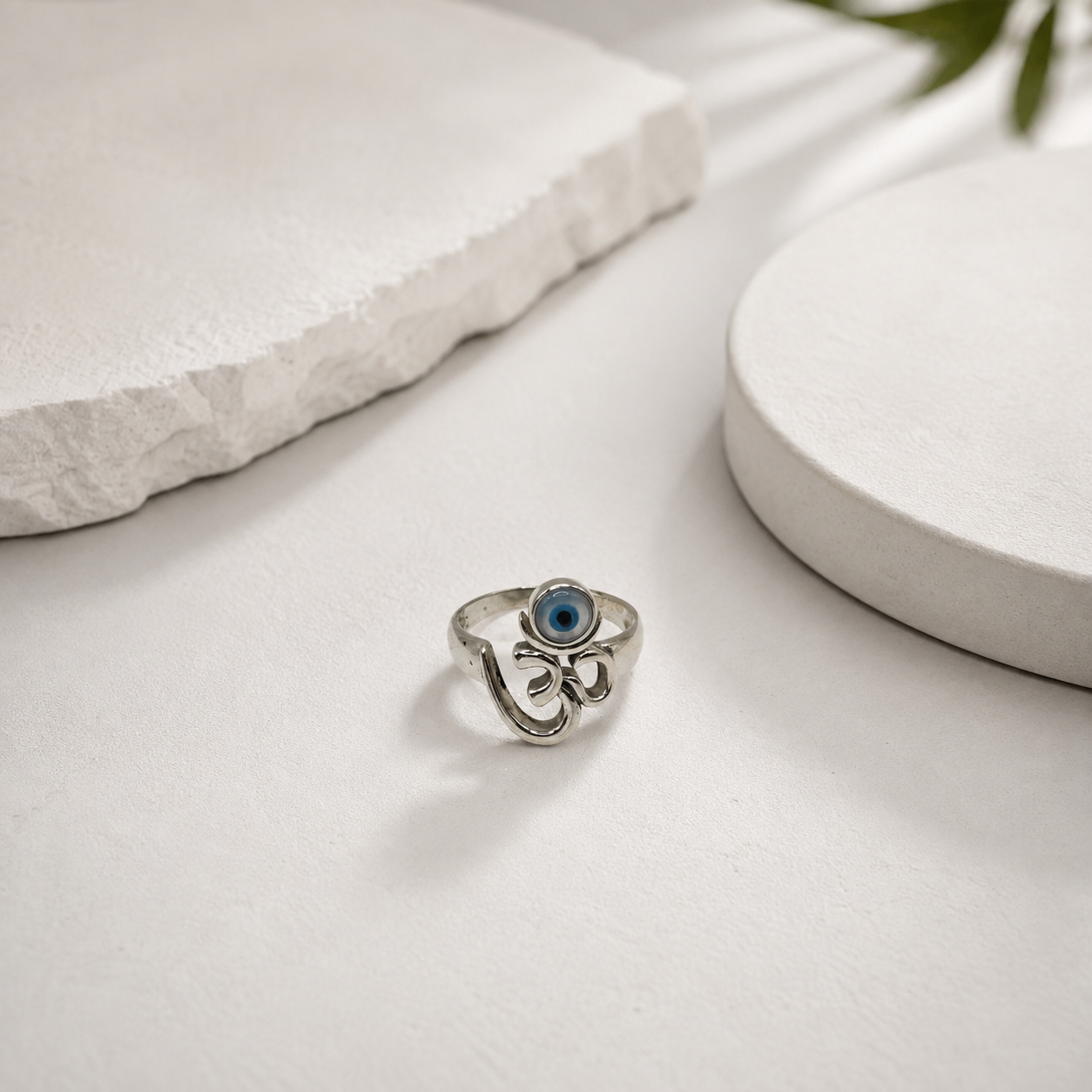 Raised om symbol and evil eye on a silver ring