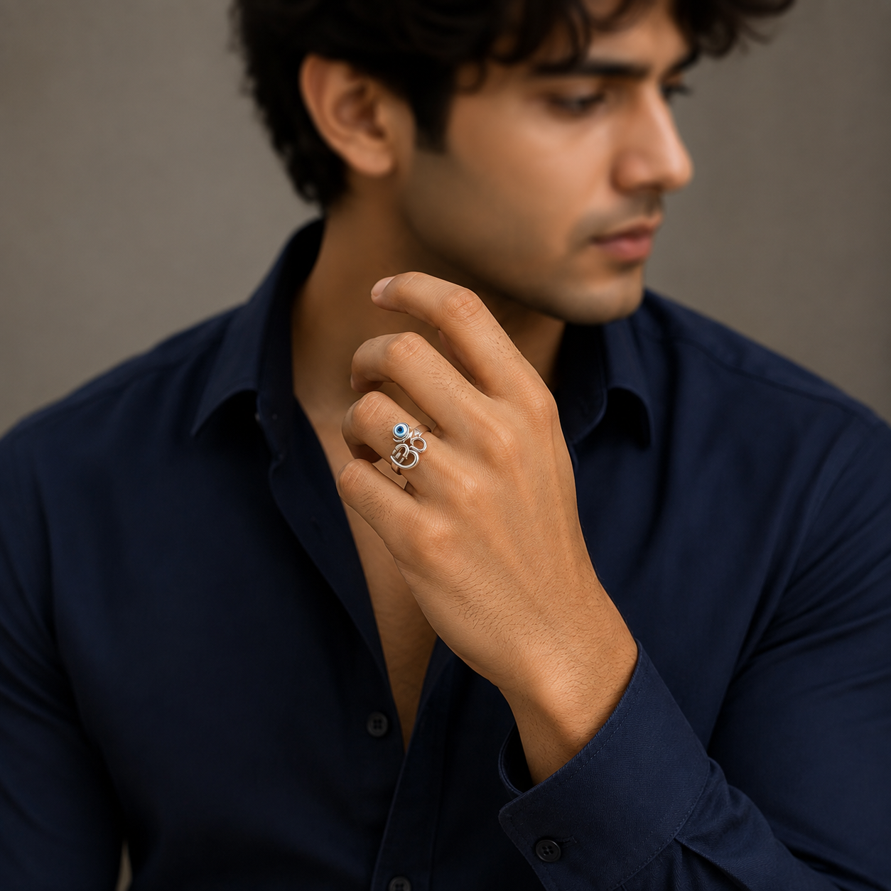 Om ring in silver with bezel set evil eye