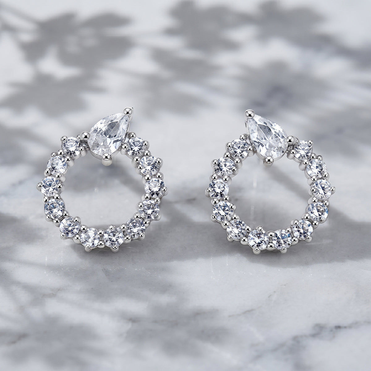 Silver Open Circle Pear Accent Stud Earrings