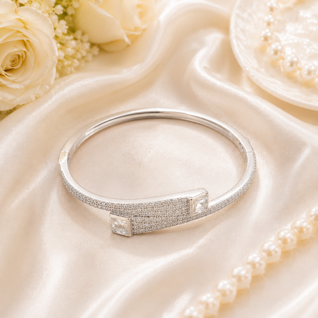 Detailed angle showing the smooth inner lining and hinge mechanism of the silver bypass bracelet.