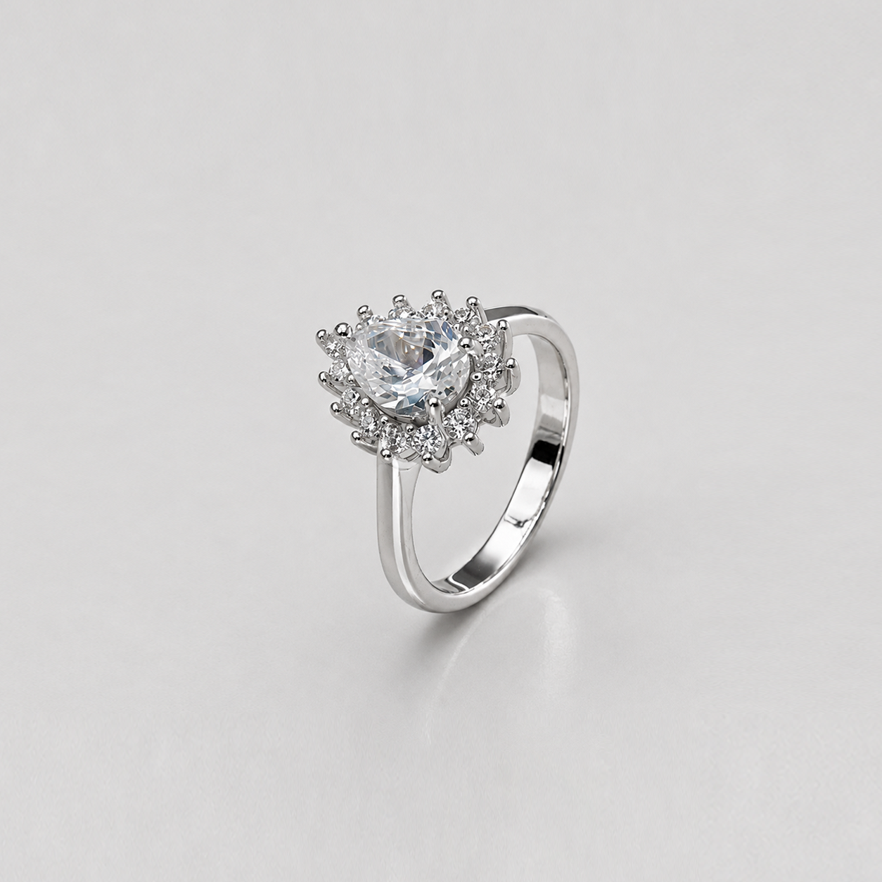 Silver Pear Cut Sunburst Halo Ring