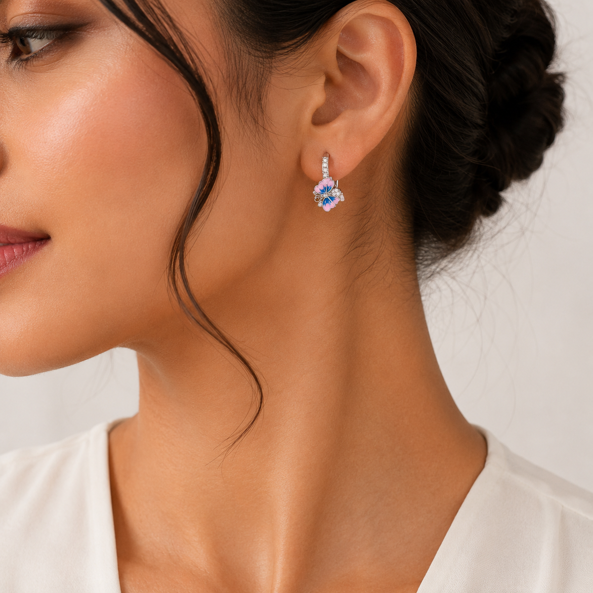 Model wearing Silver Pink and Blue Enamel Butterfly Huggie Drop Earrings with colourful butterfly drops