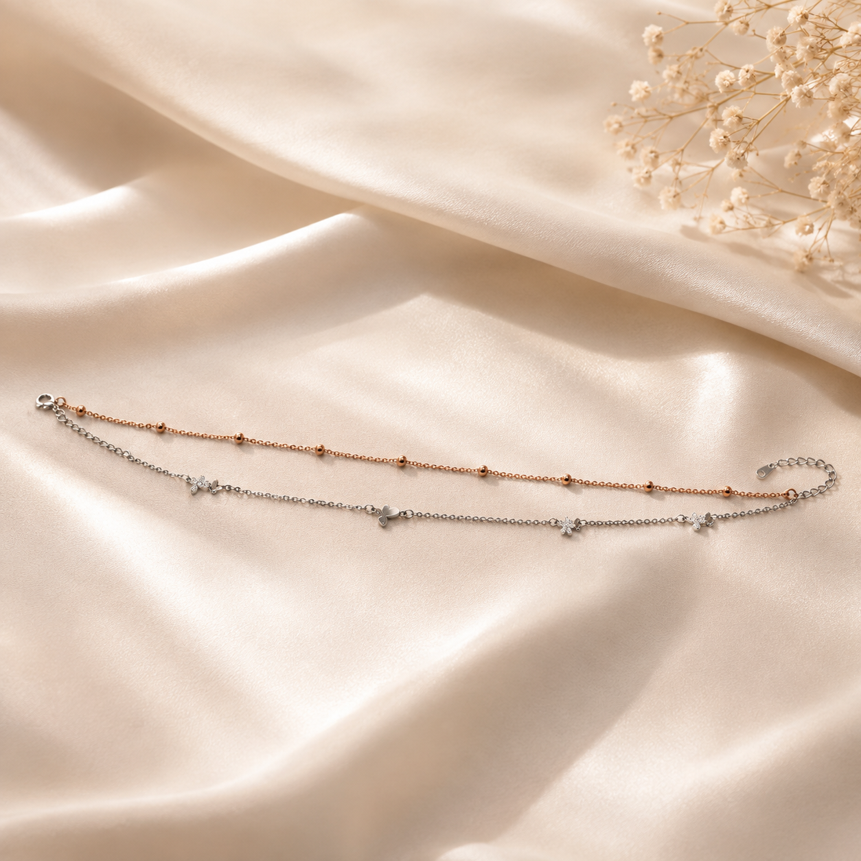 Pave butterfly charms on a two tone layered anklet