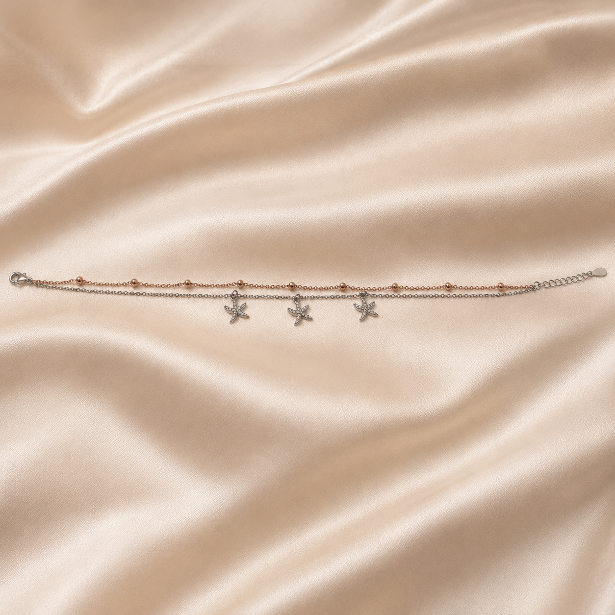 Two tone starfish charms on a double chain anklet