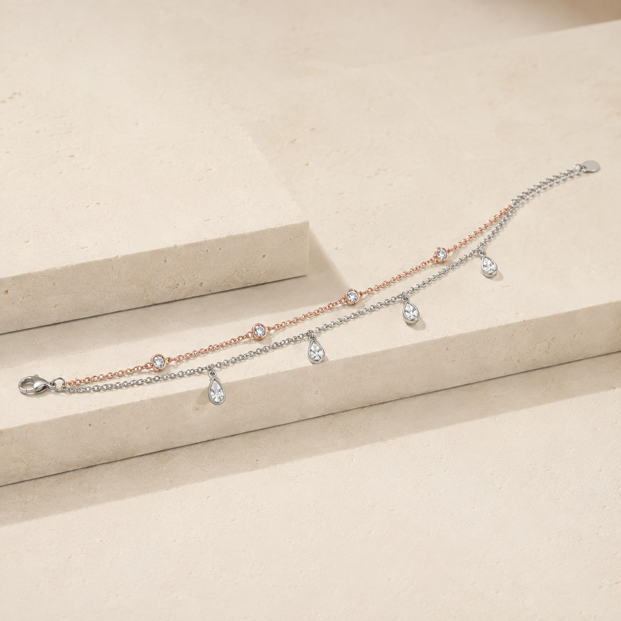 Teardrop drops on a fine two tone silver anklet