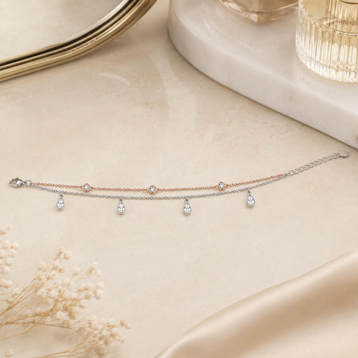 Pave teardrop charms on an adjustable silver anklet