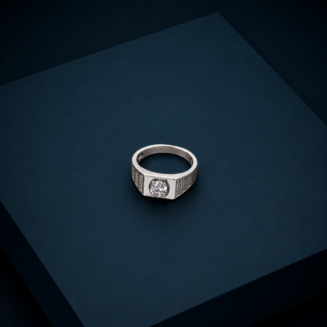 Tapering pave shoulders on a silver mens ring