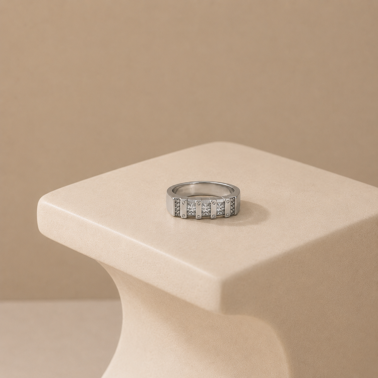 Channel set square stones on a flat silver band