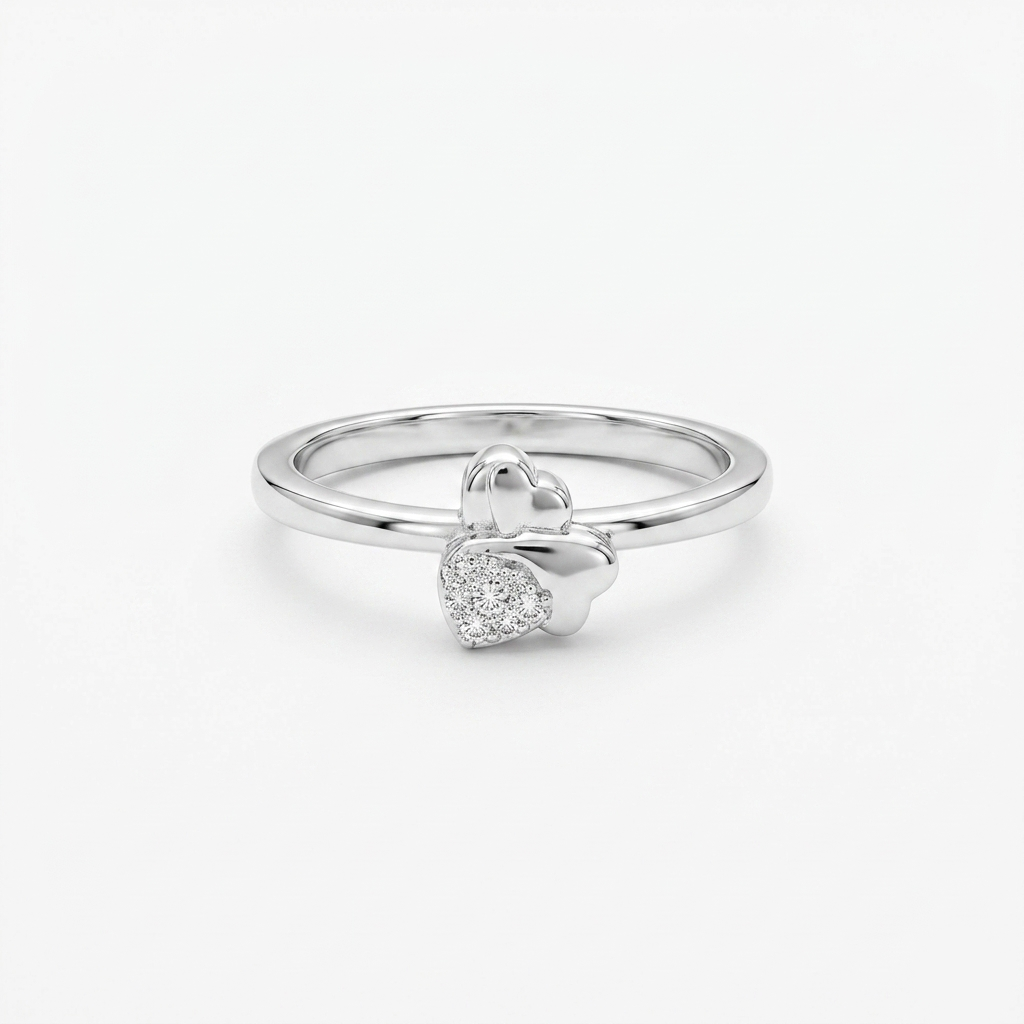Close-up of the Sparkling Twin Heart Silver Ring on a white background showing the polished and pave-set hearts.