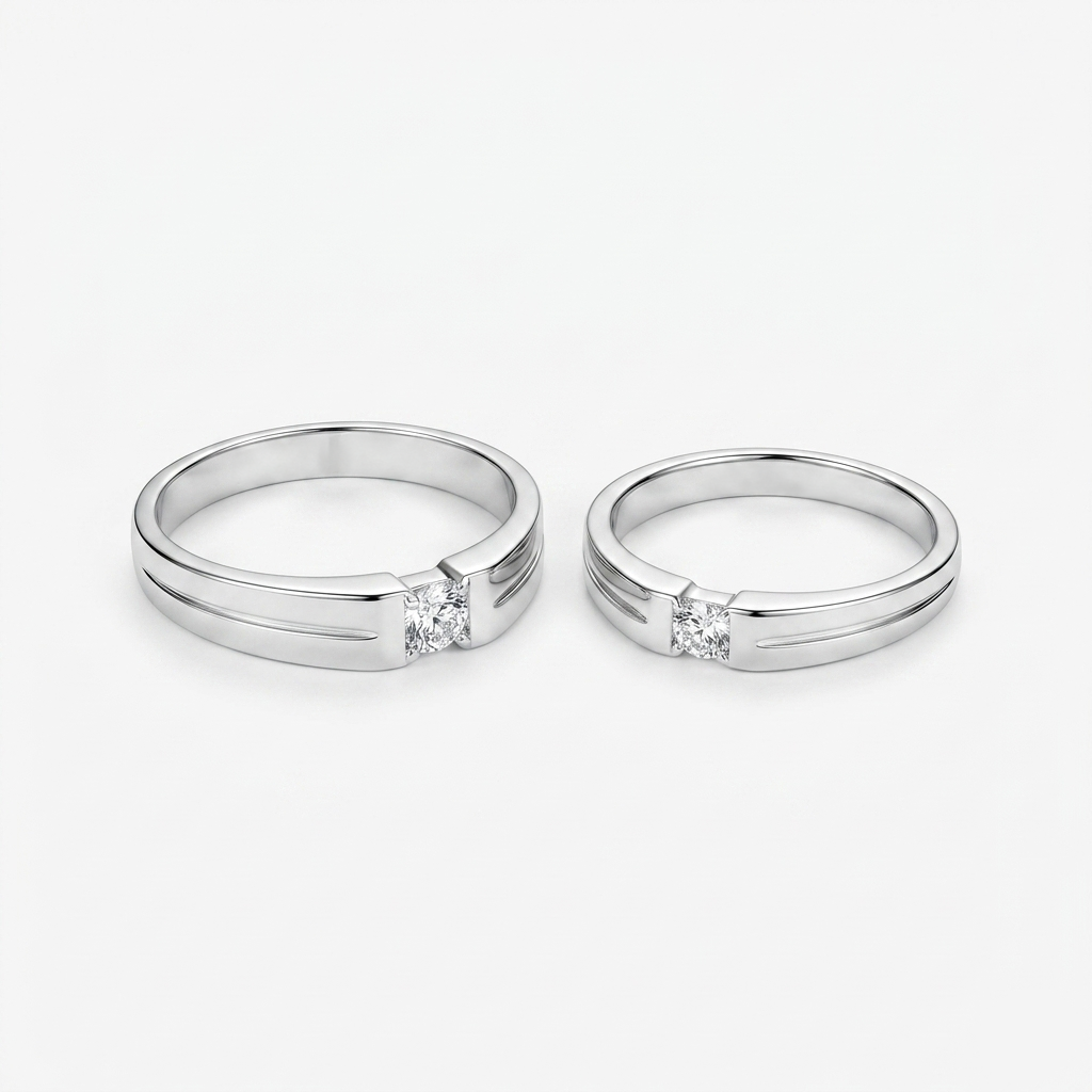 Close up of two Square Solitaire Silver Couple Bands with parallel grooves and a square solitaire stone against a white background.