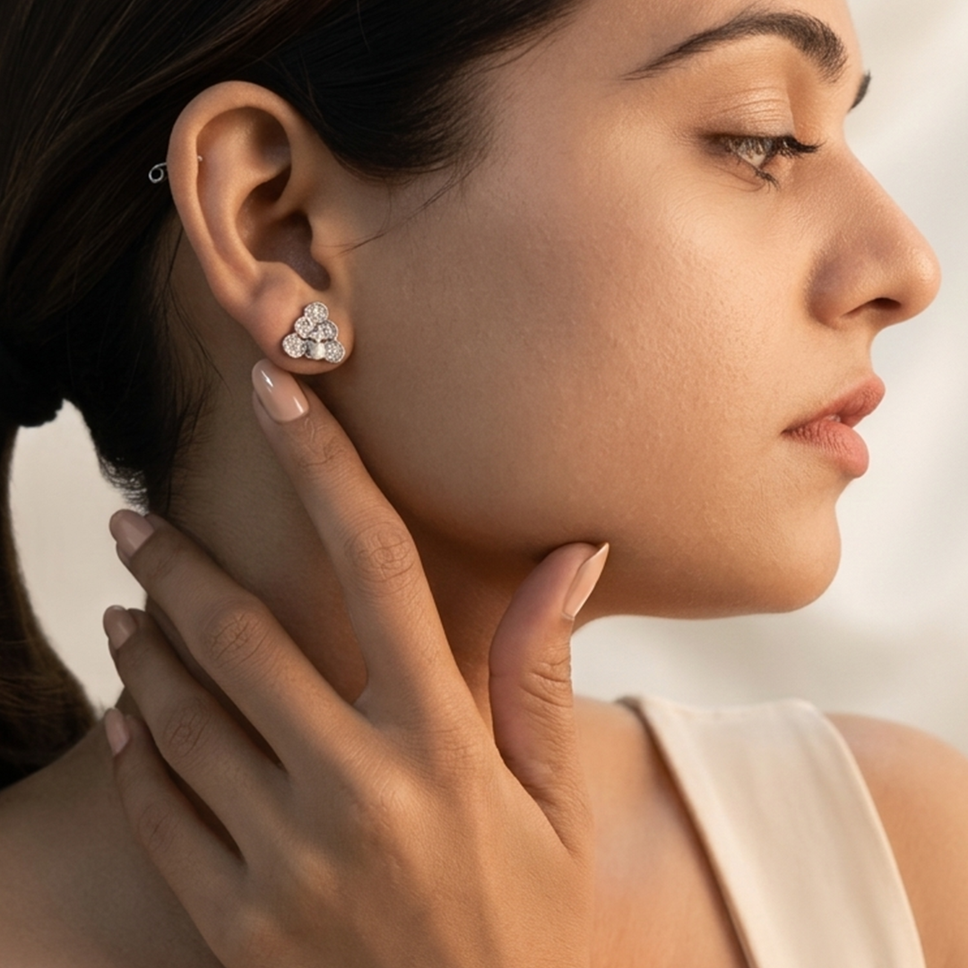 Close up portrait of a woman showcasing the sparkling Sterling Silver Floral Cluster Stud Earring on her earlobe